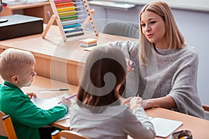 Teacher and student in the classroom during the first maths lesson