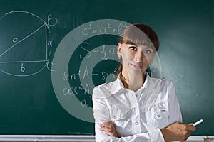 Young teacher woman or student at the blackboard