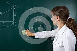 Young teacher woman or student at the blackboard