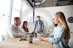 Young team of coworkers making great business discussion in modern coworking office.Teamwork people concept