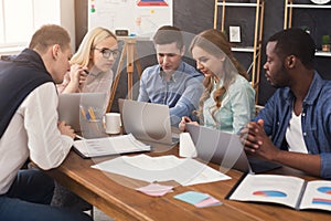 Young team discussing project in modern office