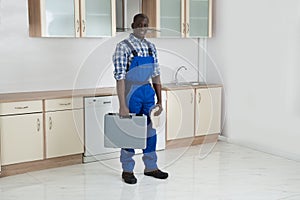 Young Technician Holding Toolbox