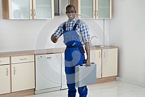 Young Technician Holding Toolbox