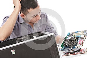 Young technician look confuse fixing computer hardware