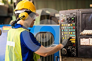 Young technicians factory worker controlling the work. Engineer checking and monitoring the electrical system in the industrial.