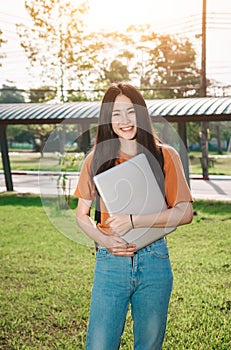 A young or teen asian girl student in university