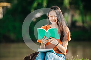 A young or teen asian girl student in university