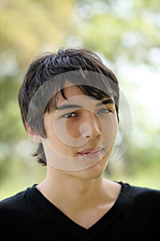 Young Teen boy outdoor portrait dark hair