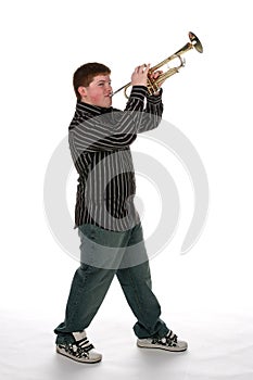 Young teen boy playing trumpet