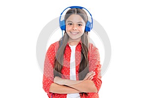 Young teen child listening music with headphones. Girl listening songs via wireless headphones. Wireless headset device