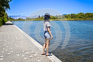 Young teen girl on the shore of Titreyen Gol lake in Turkey