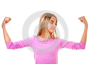 Young teen girl showing her muscular arm for feminine and independent strength,isolated