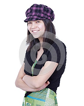 Young teen girl smiling, arms crossed, wearing hat