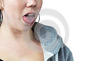 Young teen girl with tongue piercing and hoodie