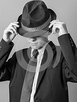 Young Teen posing in Hat, Suit and Tie