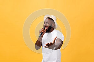 Young teenage black African American boy singer performing at a concert.