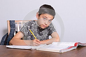 Young teenage boy doing his homework