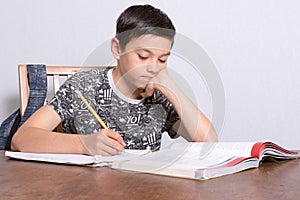 Young teenage boy doing his homework