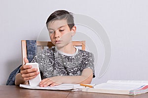 Young teenage boy doing his homework