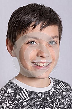 Young teenage boy with a milk moustache