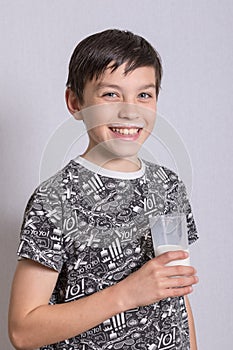 Young teenage boy with a milk moustache