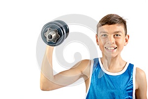 Young teenage boy using dumbbells