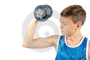 Young teenage boy using dumbbells