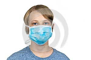 Young teenage boy wearing a protective mask. Isolated on white