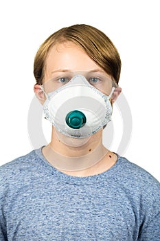 Young teenage boy wearing a protective mask. Isolated on white