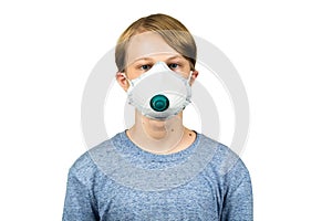 Young teenage boy wearing a protective mask. Isolated on white