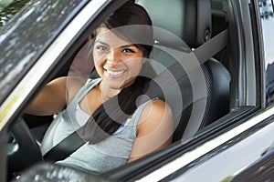 Young teenage girl driving.