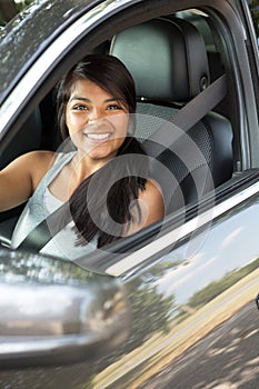 Young teenage girl driving.