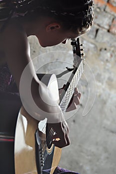 Young teenage girl with guitar