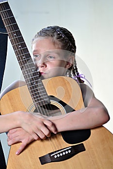 Young teenage girl with guitar