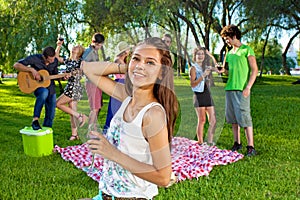 Young teenage girl partying with friends