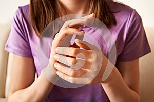 Teenage girl practicing EFT tapping - emotional freedom technique photo