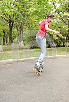 Young teenage girl skating on roller blades