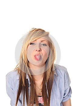 Young teenage girl sticking out tongue