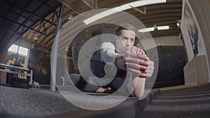 Young teenaged athlete doing stretching exercises