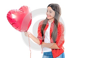 Young teenager child girl with heart shape balloon. Happy Valentines Day. Love and pleasant feelings concept. Portrait
