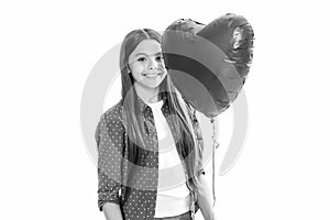 Young teenager child girl with heart shape balloon. Happy Valentines Day. Love and pleasant feelings concept. Portrait