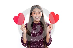 Young teenager child girl with heart shape. Happy Valentines Day. Love and pleasant feelings concept. Portrait of happy