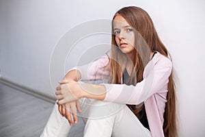 Young teenager girl looking with disbelief and disgust