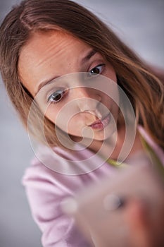 Young teenager girl taking a selfie - feeding the social media