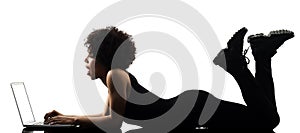 Young teenager girl woman computer laptop shadow silhouette isol