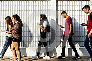 Young teenager looking into their phone photo