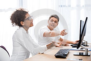 young teenager students pointing on screen