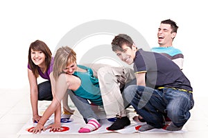 Young teenagers playing twister