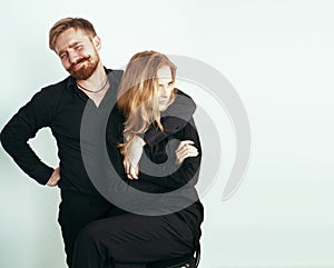 Young tender couple, man and woman in love isolated on white, fooling around real modern hipster marriage, lifestyle