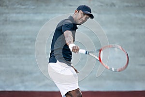 Young tennis player practicing backhand volley hit
